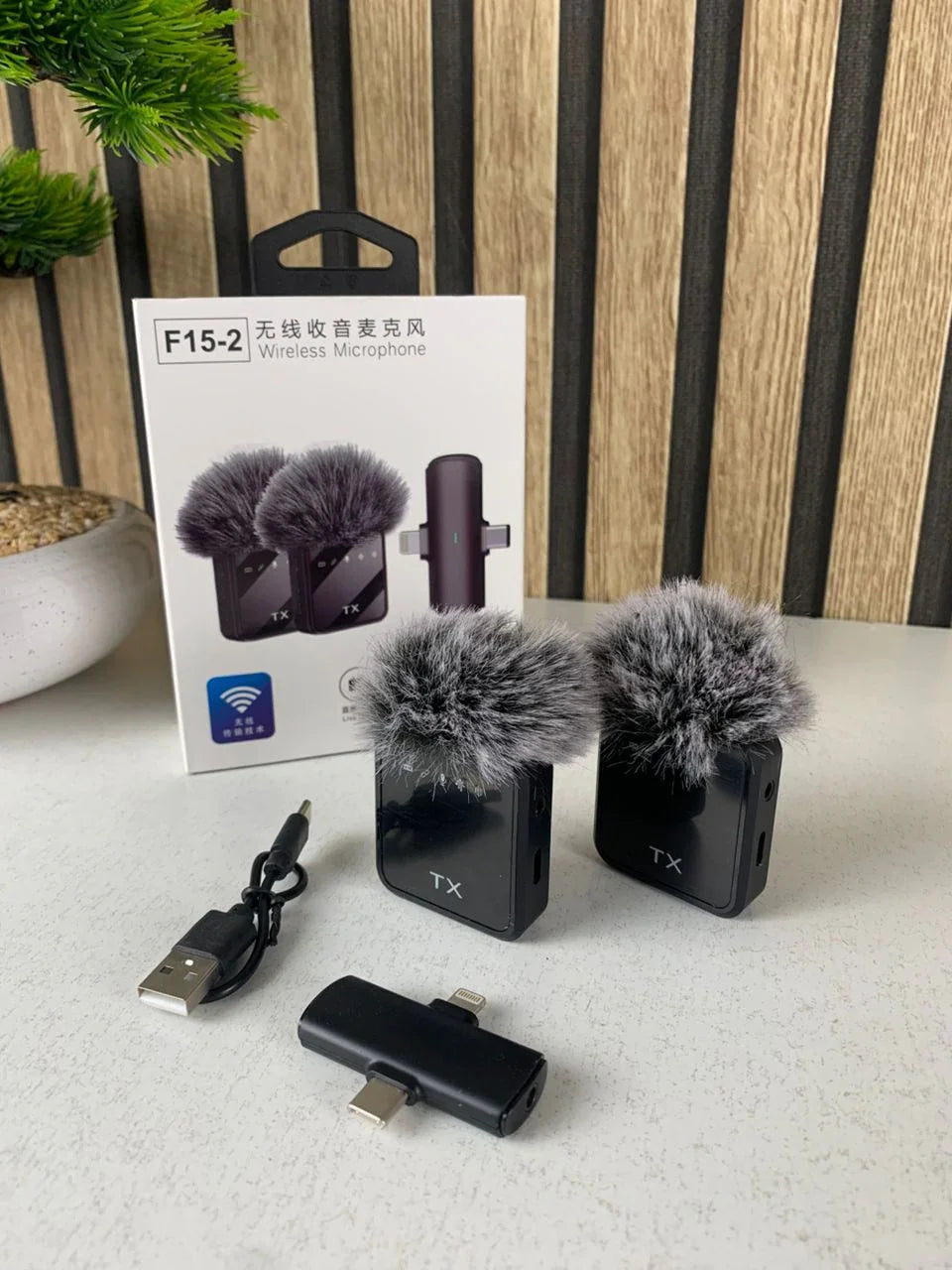 Double-Microphone-Sans-Fil-Professionnel-2en1-pour-iPhone-et-Android-F15-2-ميكروفون-لاسلكي-2قطع-متعدد-المنافذ.png