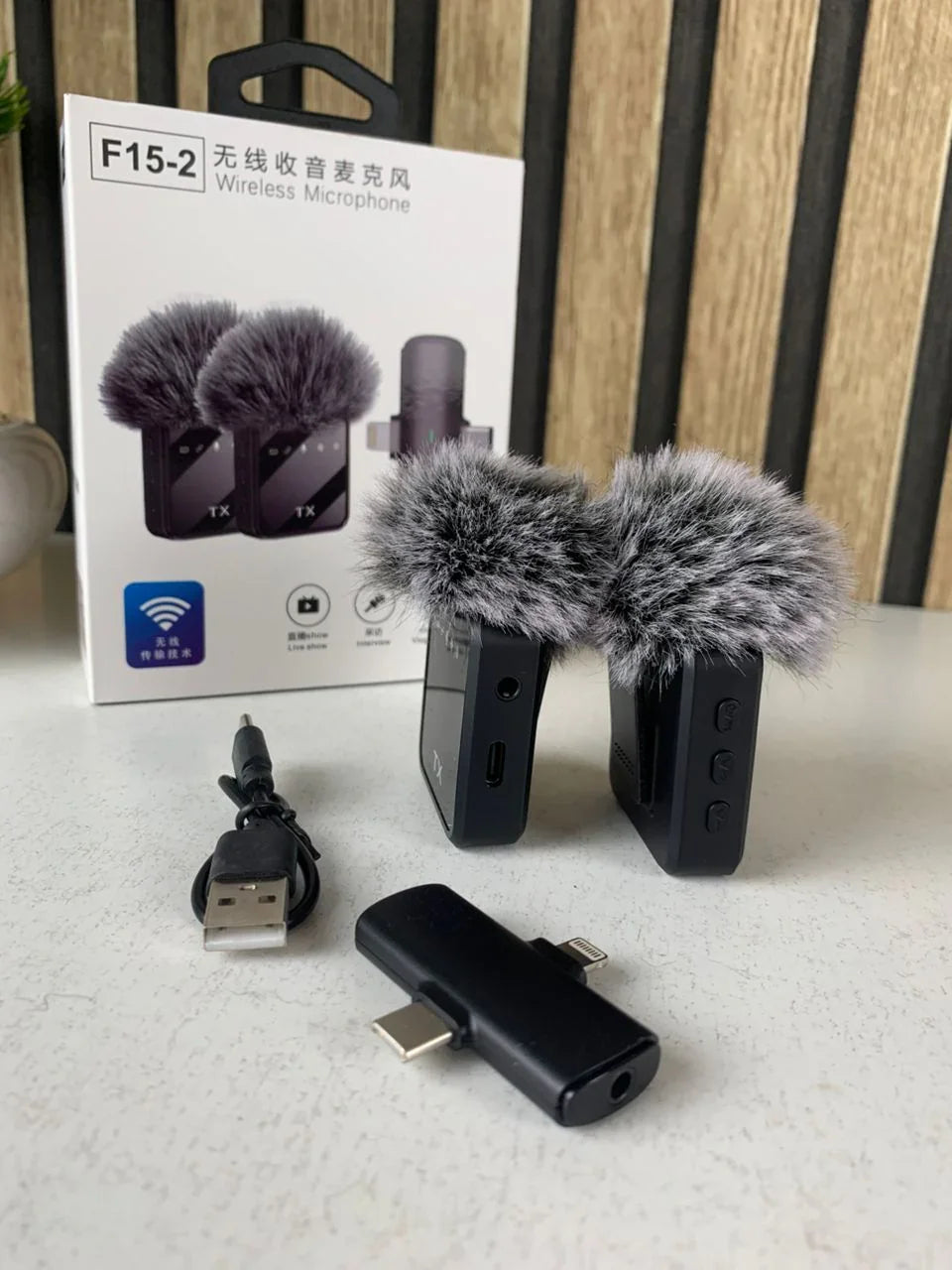 Double-Microphone-Sans-Fil-Professionnel-2en1-pour-iPhone-et-Android-F15-2-ميكروفون-لاسلكي-2قطع-متعدد-المنافذ.png