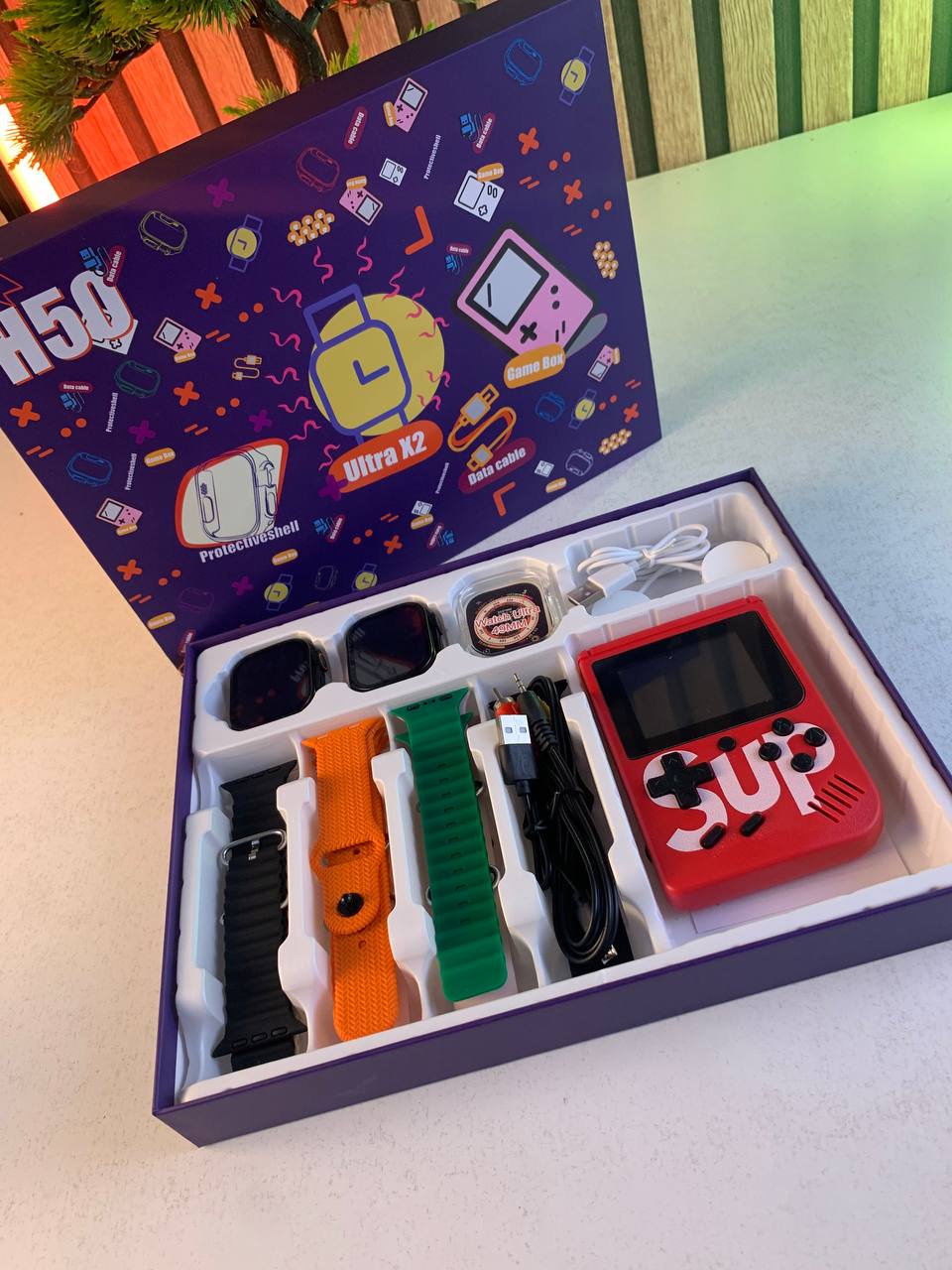Pack-2-Smartwatch-Ultra-X2-avec-7-Bracelets-et-SUP-Gamebox-400-Jeux-طقم-ساعتين-ذكيتين-مع-جهاز-ألعاب-كلاسيكية.png