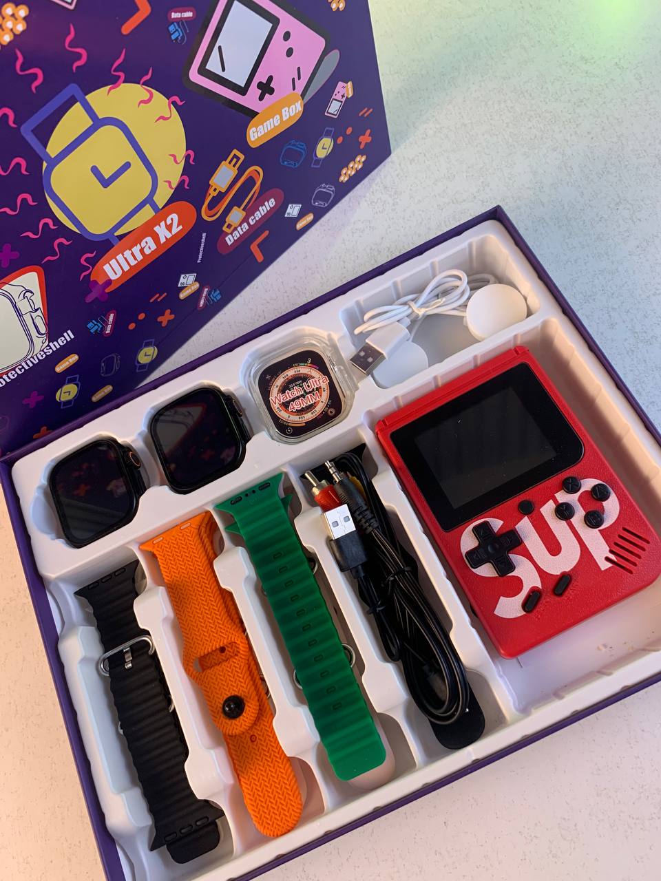 Pack-2-Smartwatch-Ultra-X2-avec-7-Bracelets-et-SUP-Gamebox-400-Jeux-طقم-ساعتين-ذكيتين-مع-جهاز-ألعاب-كلاسيكية.png
